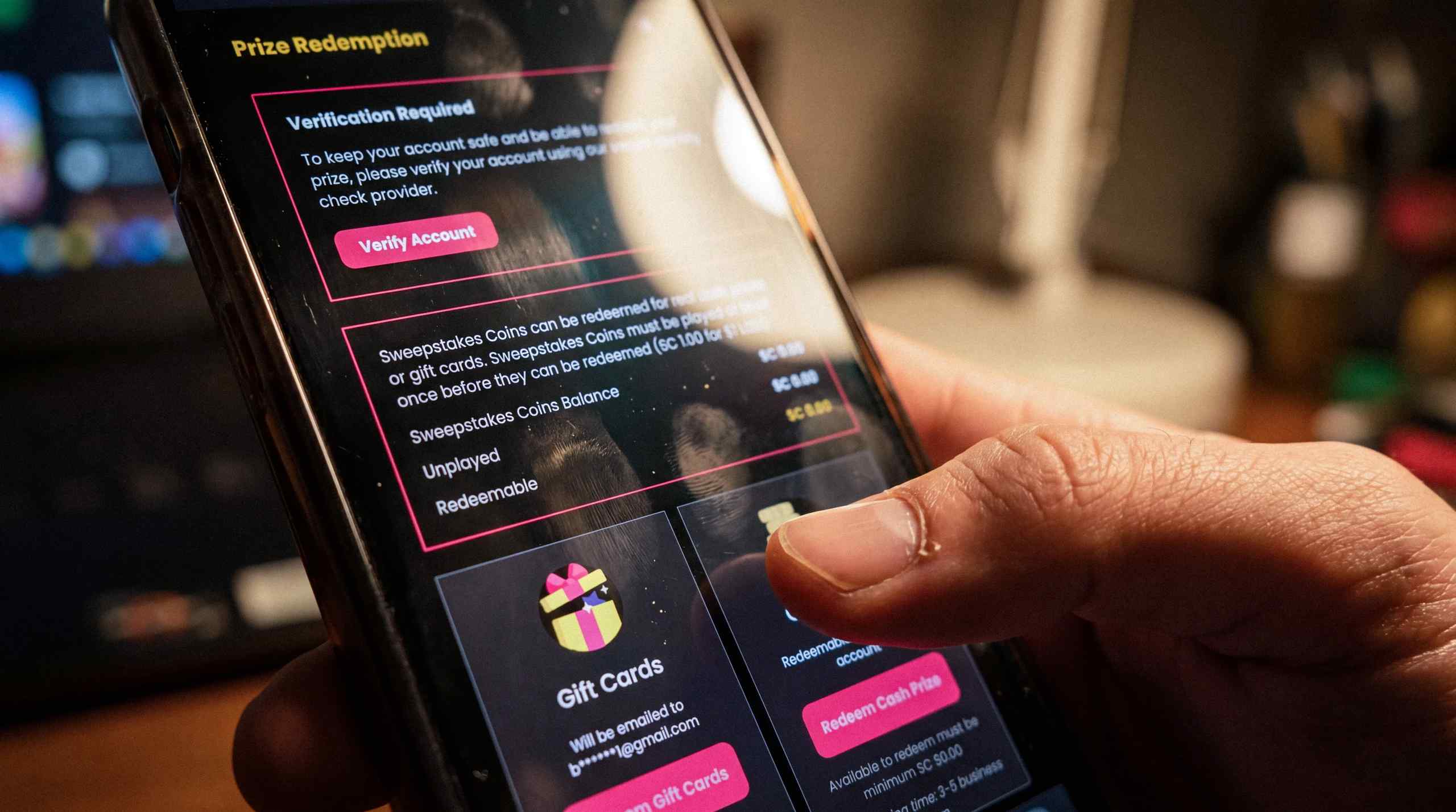 A man making a cash redemption on a sweepstakes casino on his mobile device.